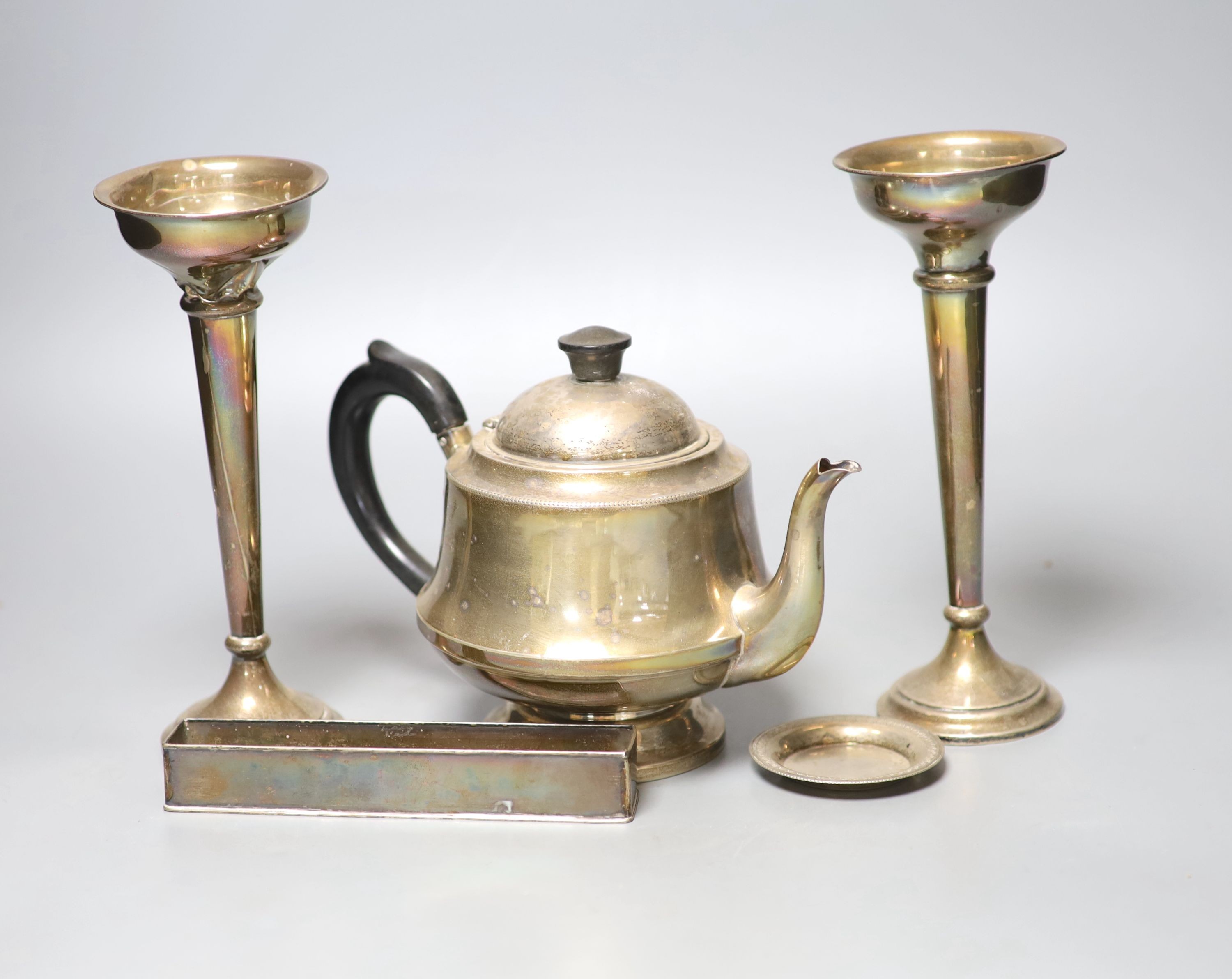 A 1930's silver teapot, a pair of silver mounted posy vases(a.f.), an Egyptian white metal small dish and a metal trough, weighable silver gross 11oz.